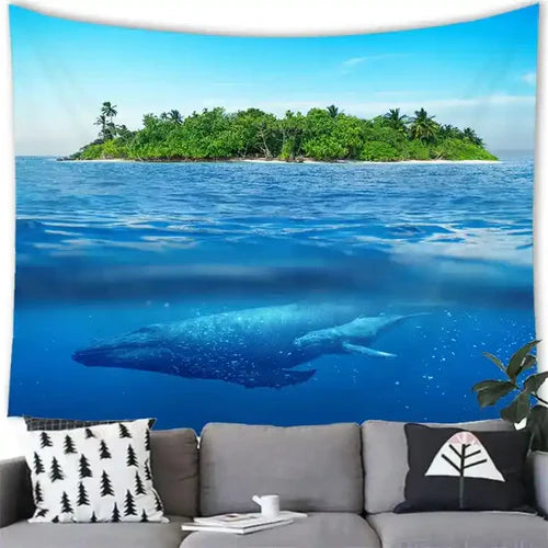 eine couch steht vor einem grossen bild mit einem ozean und einem schwimmenden wal vor einer insel